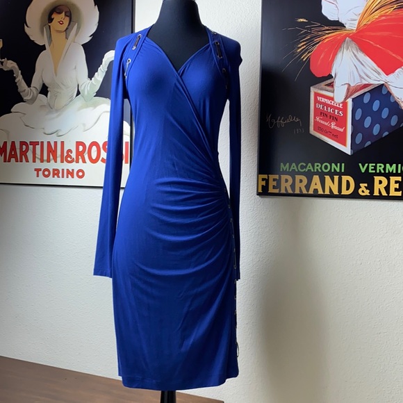 Carmen Marc Valvo Dresses & Skirts - 💙Sexy wrap dress embellished with leather. Small